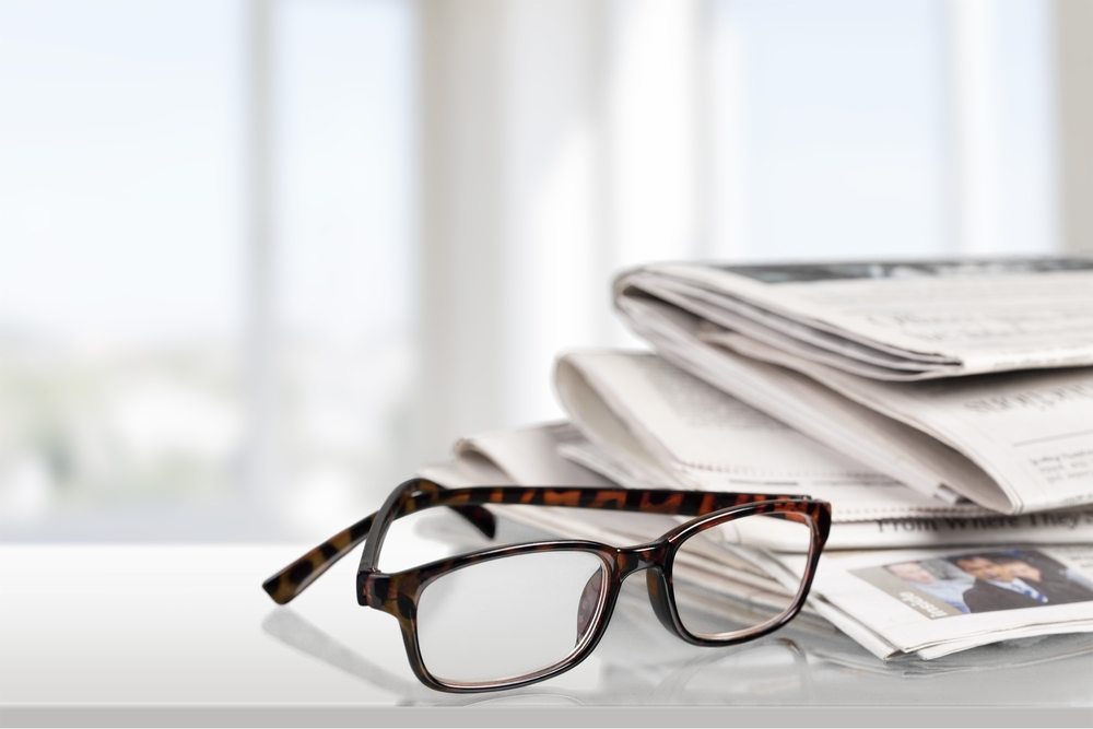 glasses with newspaper